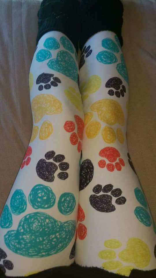 One Size Multi Color Paw Print Leggings on Creme Background